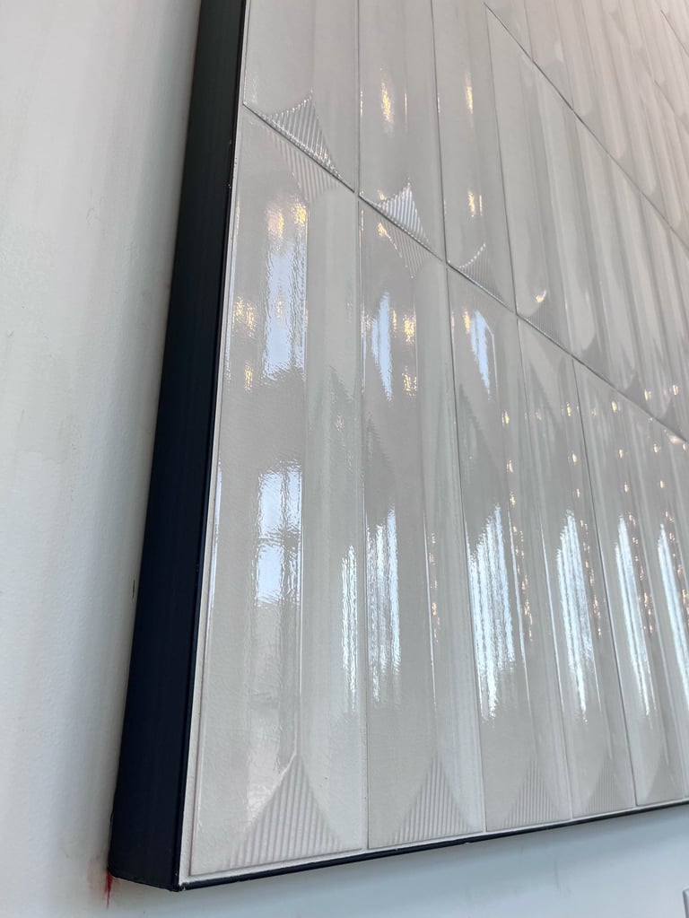 Close-up of a cracked or damaged computer screen displaying vertical light streaks and white patches against a gray background